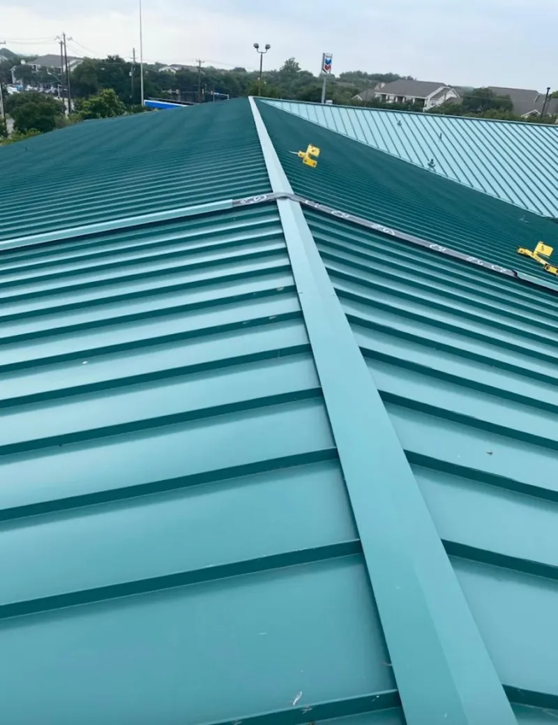 Green commercial metal roof ridge and valley for Metal Roof Repair in Shorewood